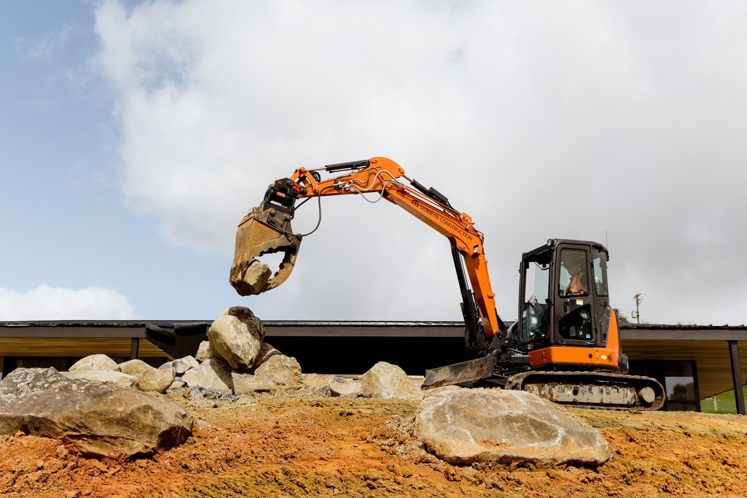 A Dobbyn excavator working on a building site