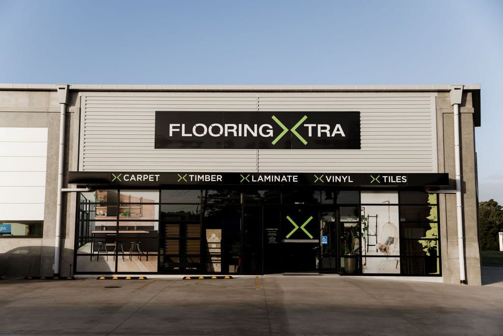 Flooring Xtra shopfront with full-height glazed entrance