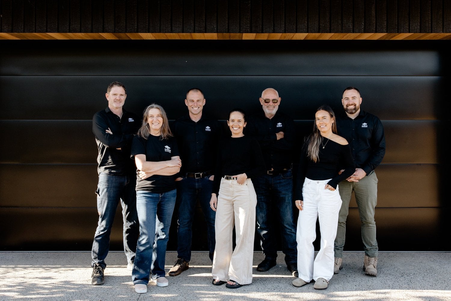 The Dobbyn Builders project management team together outdoors