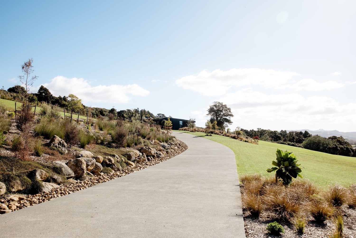 Curved path through the Takatu landscaped grounds