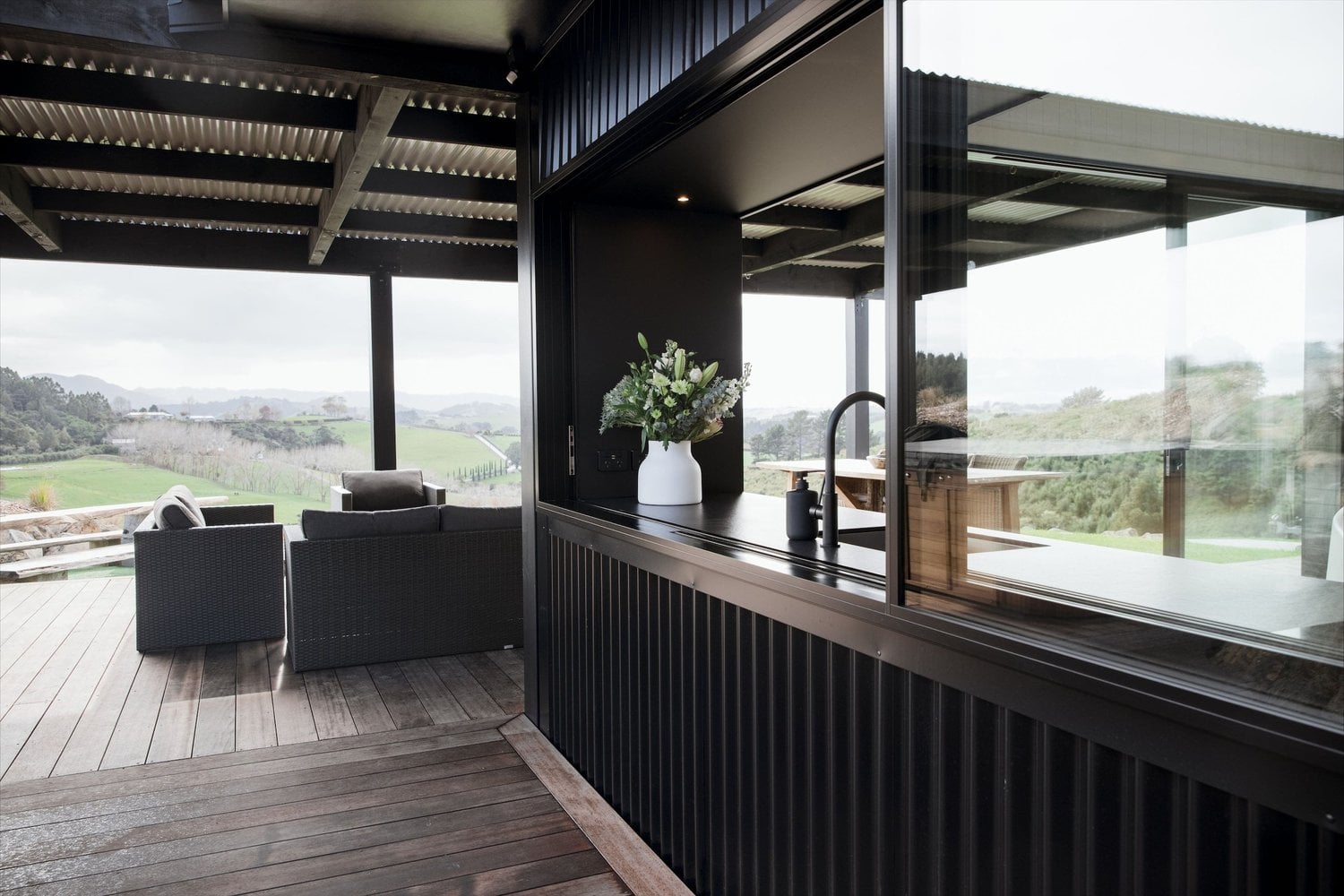 The Cabin serving window and deck overlooking the countryside